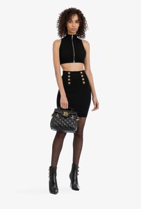 high waisted black buttoned skirt