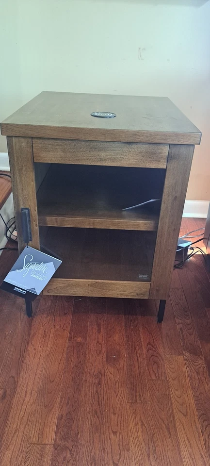 Mesa de centro elevadora marrón Signature Design by Ashley Torlanta Foto 4 de 4