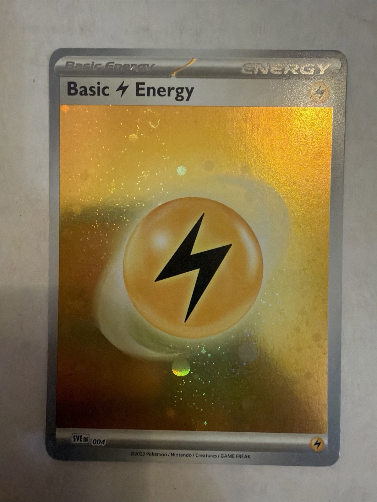 Basic Lightning Energy – SVE 004 (Scarlet & Violet era) – Cosmos Holo w/ swirl