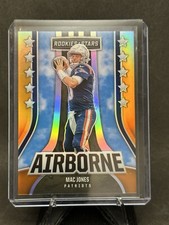 2023 Panini Rookies & Stars Mac Jones Airborne Orange 13/25 NE Patriots #AI-22