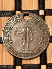 1920's Masury is Good Paint "Carry Me Lucky Be" Leks and Smalare Good Luck Token