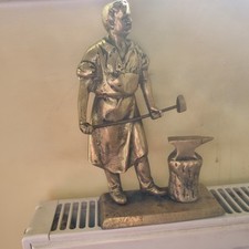 Vintage Brass Blacksmith At Anvil Standing On A Plinth With Screws To The Base .