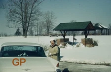 XX113-Old 35mm Slide Photo- Woman by a Car- 1962