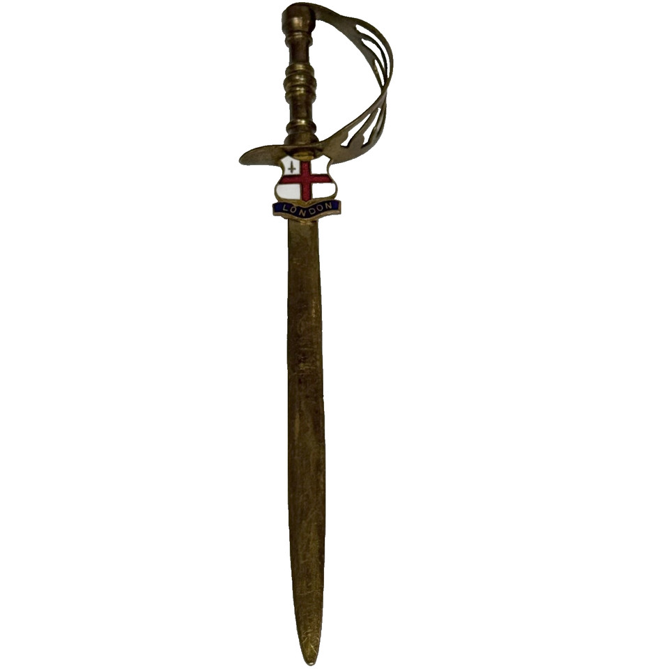 A brass sword letter opener with an enameled London crest — souvenir-meets-gentleman's-study in one surprisingly elegant little package.