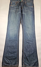 Jeans Levi's. Hombre 34/34. Denim lavado medio. Ajuste regular.  Corte de bota 527