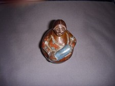 Vintage Folk Art Wood Carving of an Old Woman Holding Blanket Roll