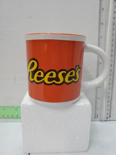 REESE'S Peanut Butter Cup Logo Mug 12 oz Galerie Hershey Orange Lip - 第 1/7 張圖片