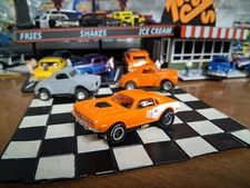 AUTO-WORLD  HEMI CUDA  ORANGE W/WHITE STRIPING AND XTRACTION CHASSIS N.O S. FREE