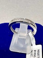 14kt.white gold wedding band with princess cut diamonds size 7.5, 2.80 grams.