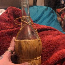 Clear Glass Wine Bottle with Straw Cover