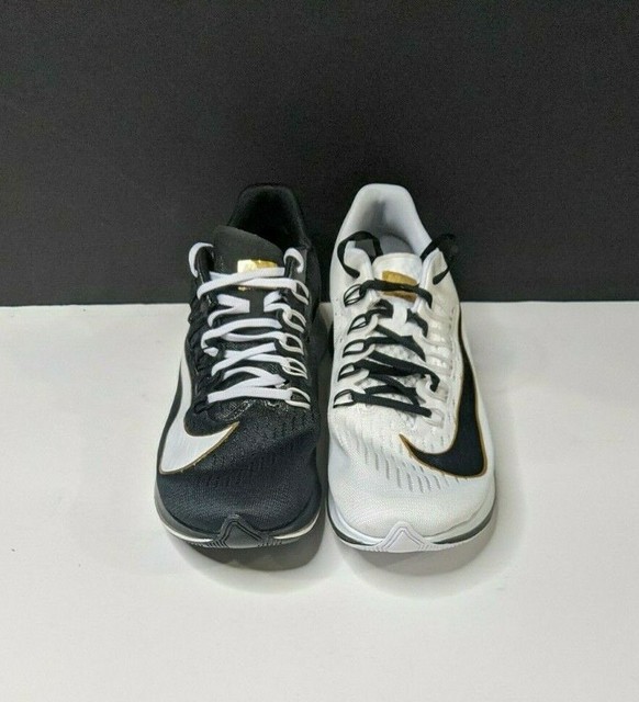 nike zoom fly black white gold