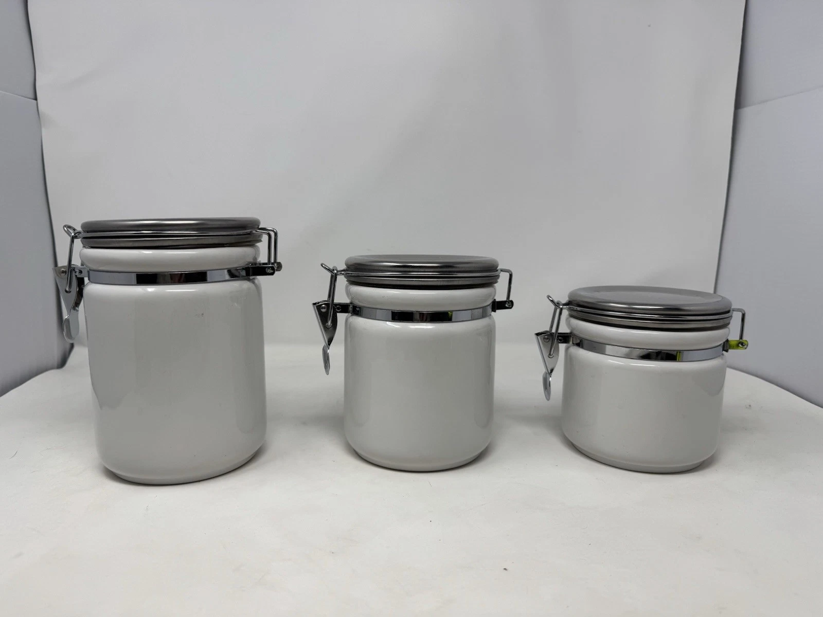 set of 3 anchor home collection white canisters with clamp tops EUC kitchen