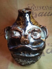  Beautiful Vintage Marie Rogers Face Jug -7 inches tall with a brown glaze.