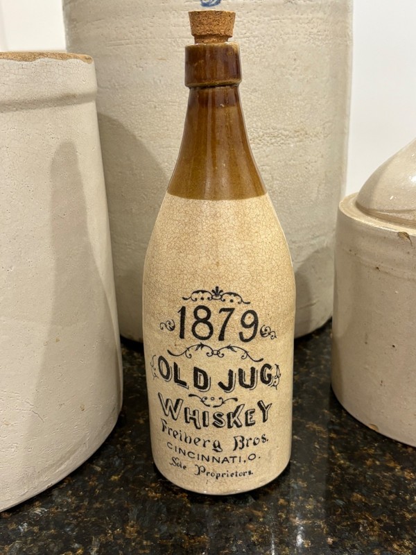 "1879 Old Jug Whiskey" stoneware whiskey bottle produced by Freiberg Bros. in Ci