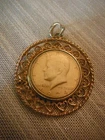 VINTAGE GOLD TONED 1974 KENNEDY HALF DOLLAR COSTUME JEWELRY PENDANT FOB