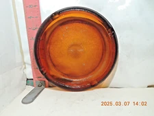 Amber glass 8 inch diameter "Party" ashtray-Starburst in center, pebbly finish