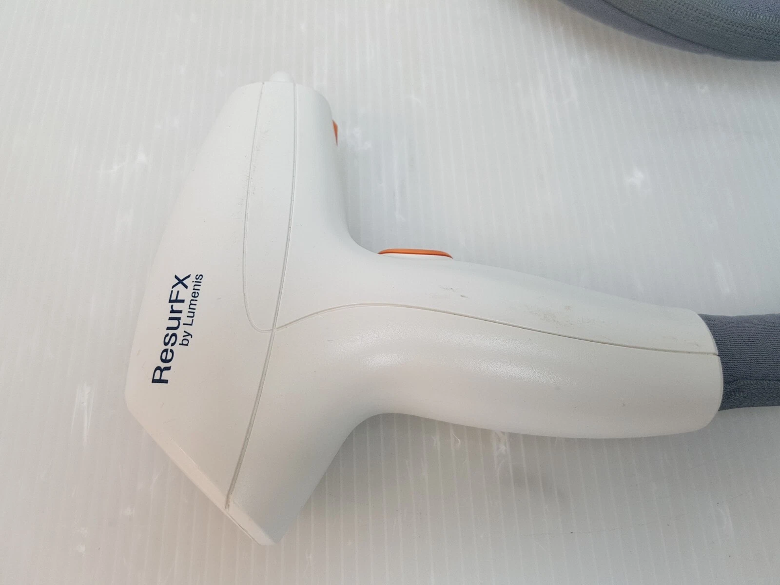 Side of the ResurFX handpiece with ResurFX by Lumenis logo