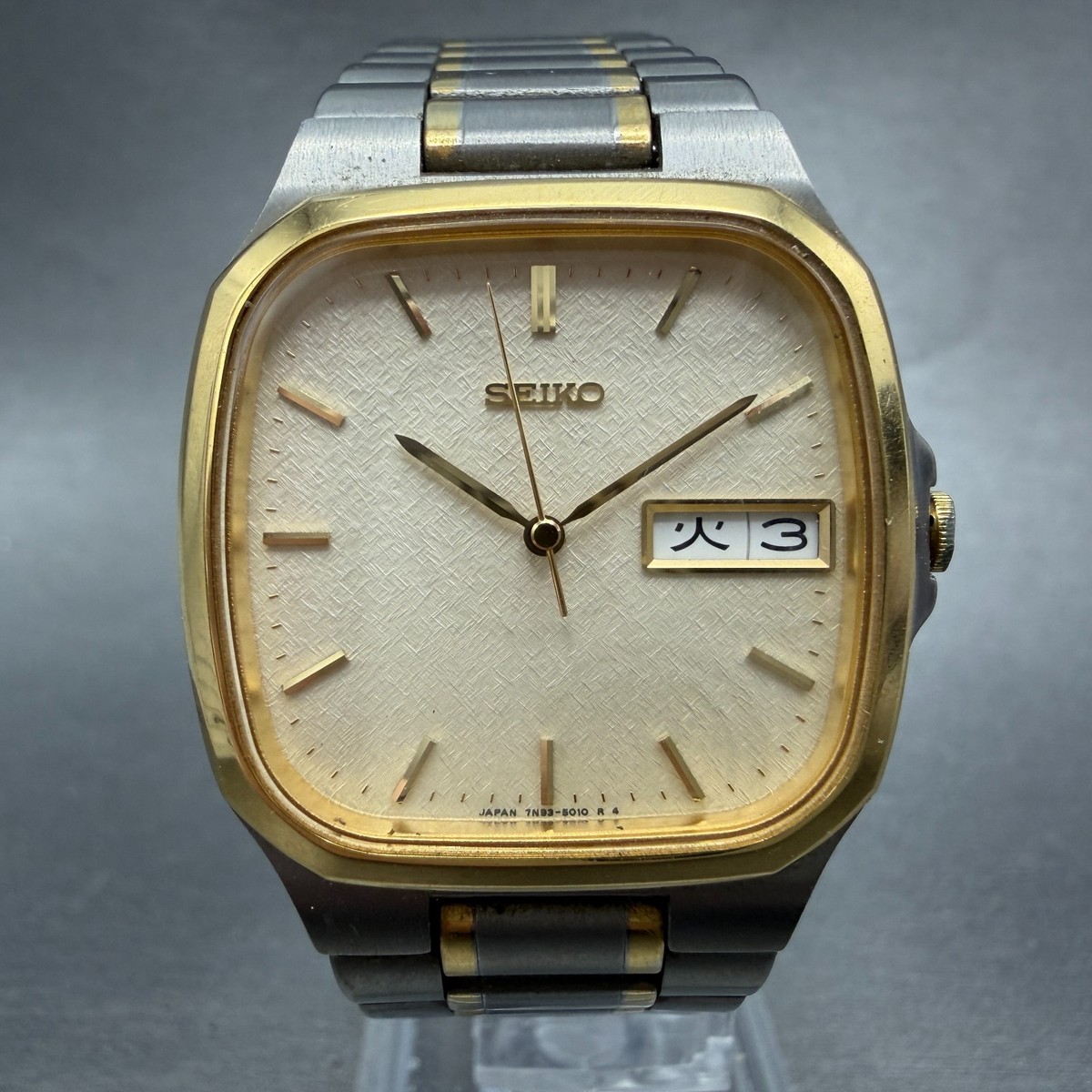 Seiko Watch Men 31mm Champagne Dial Two Tone Titanium Daydate 7N93