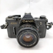 NO TARIFF Canon AE1 Black SLR Manual 35 mm CANON LENS FD 50mm 1 1.8 1848153