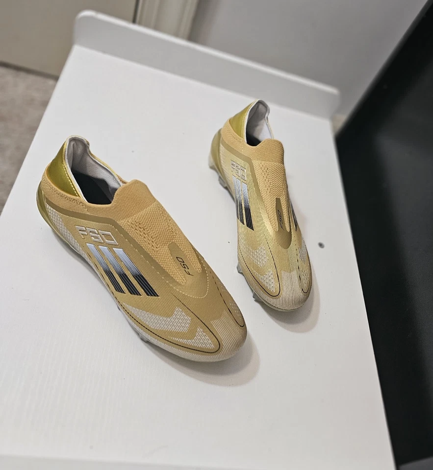 Botines de fútbol Adidas F50 Elite FG para niños color dorado Foto 2 de 4