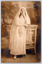 Antique girl first communion dress prayer bench cross RPPC 1910