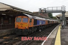 PHOTO  CLASS 66 LOCO NO 66765 + 66776 + 66303 + 66770 + 66731  PASSES BASINGSTOK