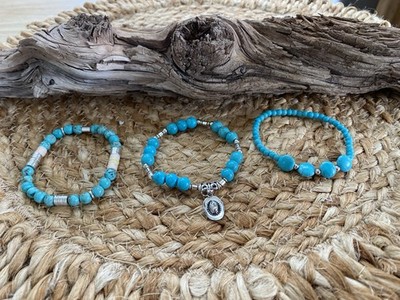 Set of 3 Turquoise Beaded Bracelets one has Silver cowboy hat charm. 