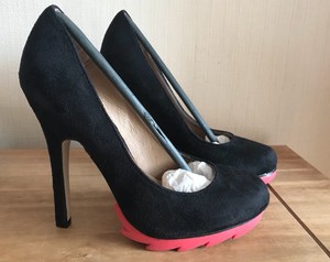 black stilettos with red soles