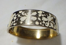 VINTAGE BANGLE BRACELET W, WHITE ENAMEL FLOWERS ON TOP HALF GOLD PLATED