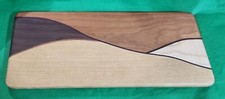 CUTTING BOARD WOOD W/INLAY OF WALNUT  17'' X 6-3/4''
