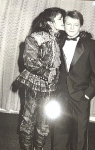 APOLLONIA Kotero Biting Michael J. Fox ear at Peoples Choice Award 1985