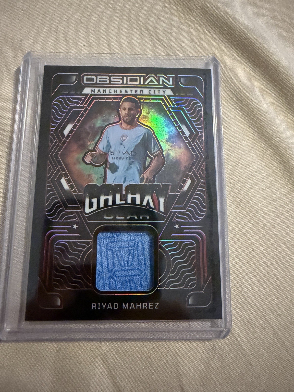 Riyad Mahrez #GG-RMZ Soccer Cards 2022 Panini Obsidian Galaxy Gear Relics trading card — raw and PSA graded price guide
