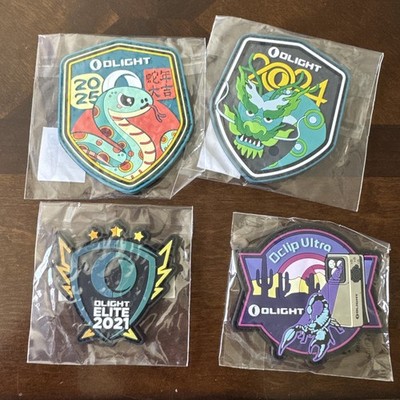 Olight Swag Patches. 2025 New Year, 2024 New Year, 2021 Elite, & Oclip Ultra. 