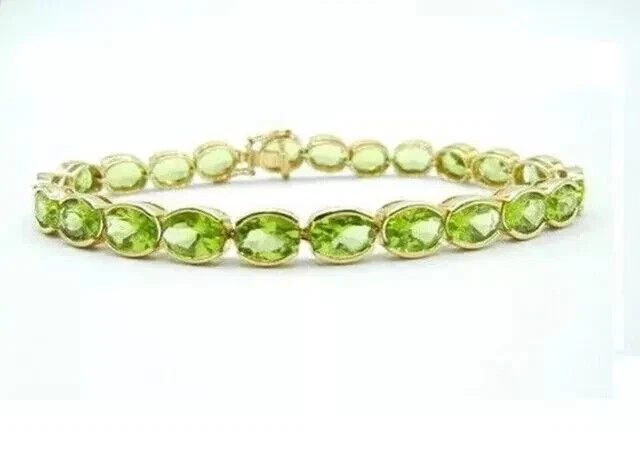 Brazalete de tenis para mujer de peridoto de corte ovalado de 6 quilates enchapado en oro amarillo de 14 quilates Foto 3 de 4