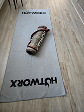 Hotworks mat and towel. Mat strap included, the mat color is brown/towel is gray
