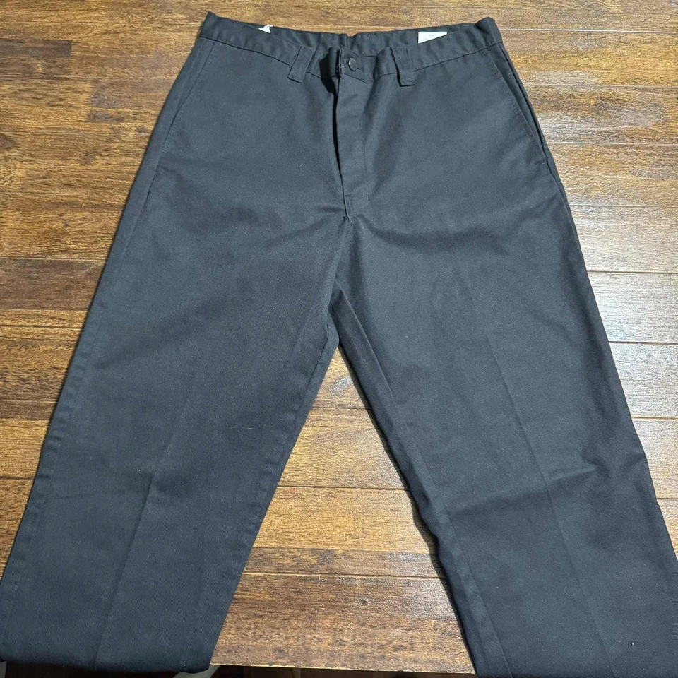 Pantalones chinos Dickies genuinos talla 34X34 negros calce regular pierna recta frente plano Foto 2 de 4