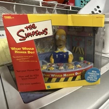 Tiger Electronics Simpsons What Would Homer Do? Handheld Electronic Trivia Game