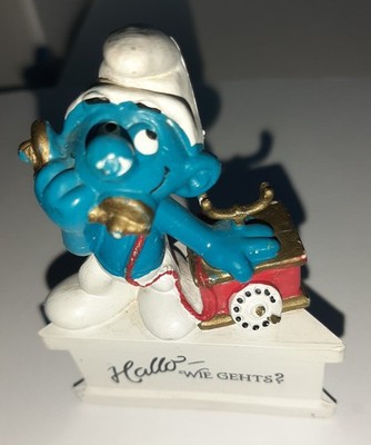 20062 Telefonschlumpf auf Dreiecksockel  Hallo, wie geht s?  Schlumpf Schlümpfe