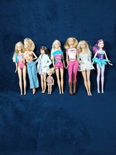 Lot of 7 Barbie Dolls and 1 Kelly Doll w/Outfits