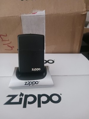 zippo lighter. Matte Black with Zippo logo. Lightly used. In good condition.