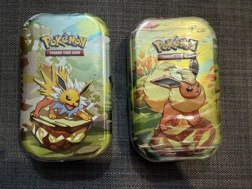 Pokémon TCG Scarlet & Violet Prismatic Evolutions 2 X Mini Tins Jolteon Flareon✅