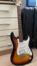 Aria Pro 2 STG Series Stratocaster in Sunburst color, with capo for free.
