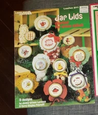 Lot of 2 Leaflets Jar Lids & Tree of Lights charted for cross stitch - 1982