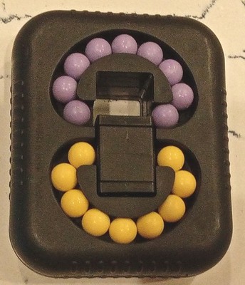 Irregular Shape Black Brain Teaser Puzzle with Yellow and Purple Beads Plastic