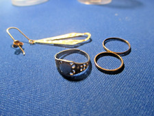 3 10K BABY RINGS AND AN EARRING NOT MARKED BUT TESTED  1.45 GRAMS
