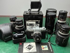 Olympus FTL 35mm SLR, 6 Auto Zuiko Lenses with Cases, Bellows, Manuals