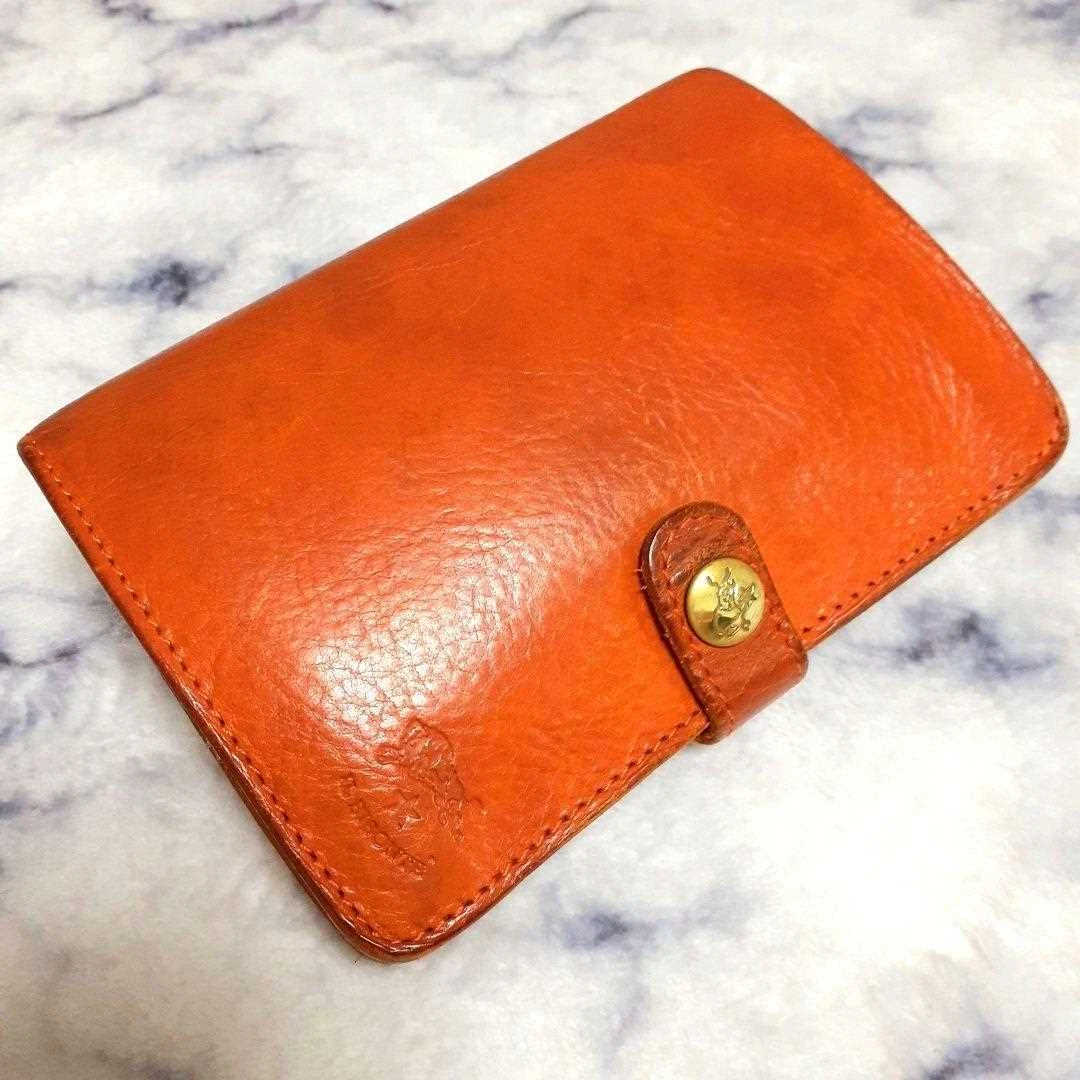 IL BISONTE notebook type bi-fold wallet orange wrinkled leather