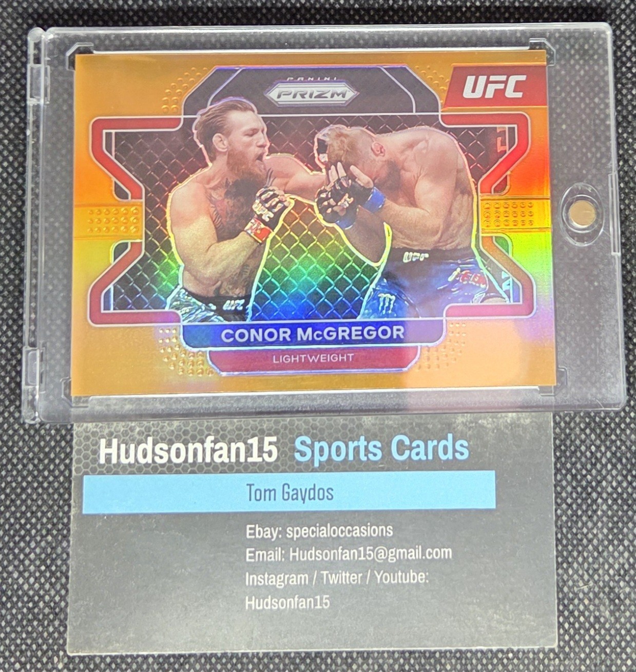 Conor McGregor 2022 Panini Prizm UFC #39 Orange Prizm 64/99 Lightweight