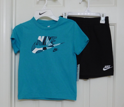 white and turquoise nike shirt