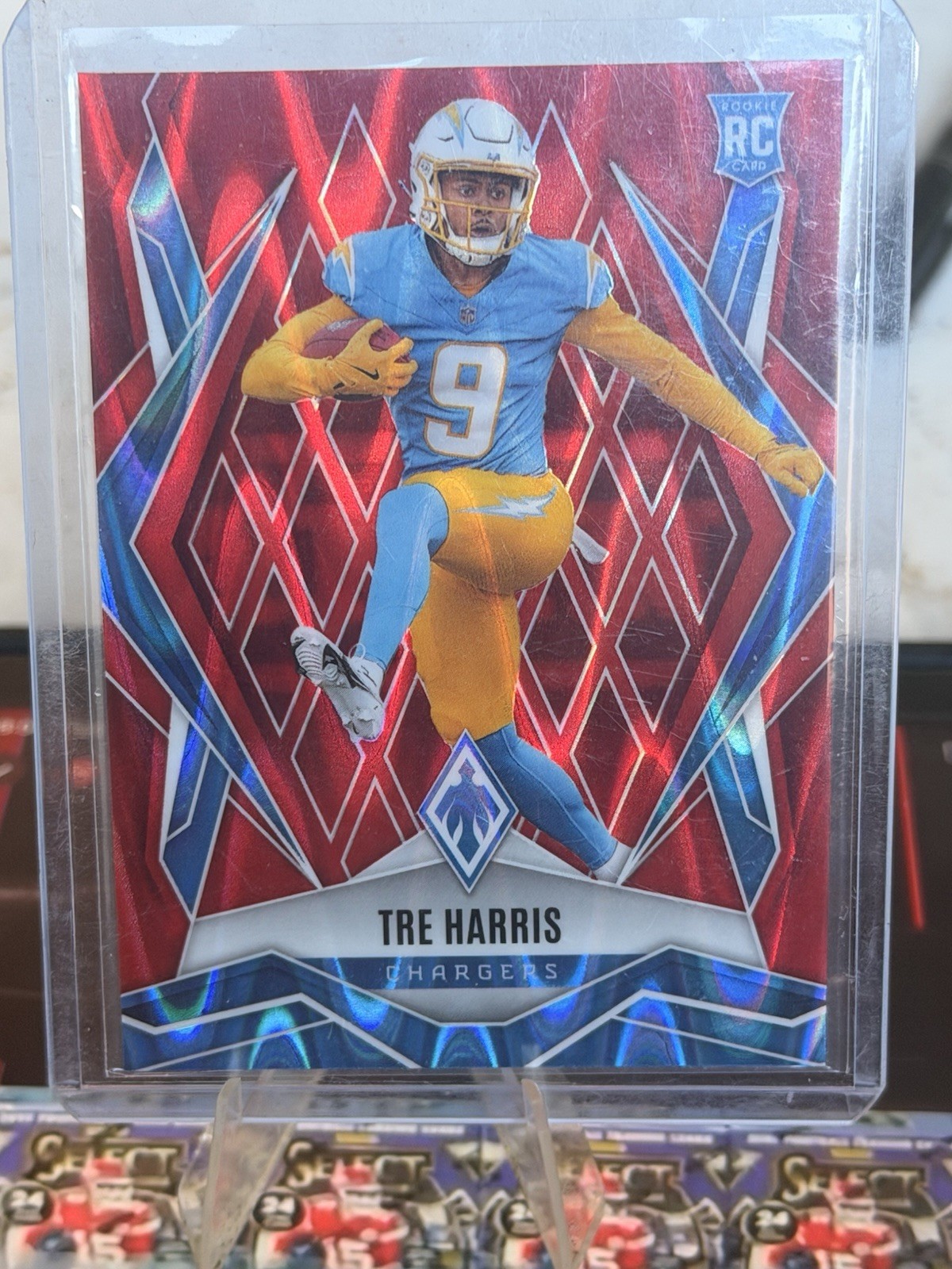 2025 Panini Phoenix - Rookies Tre Harris #160 Red Seismic /99 (RC)